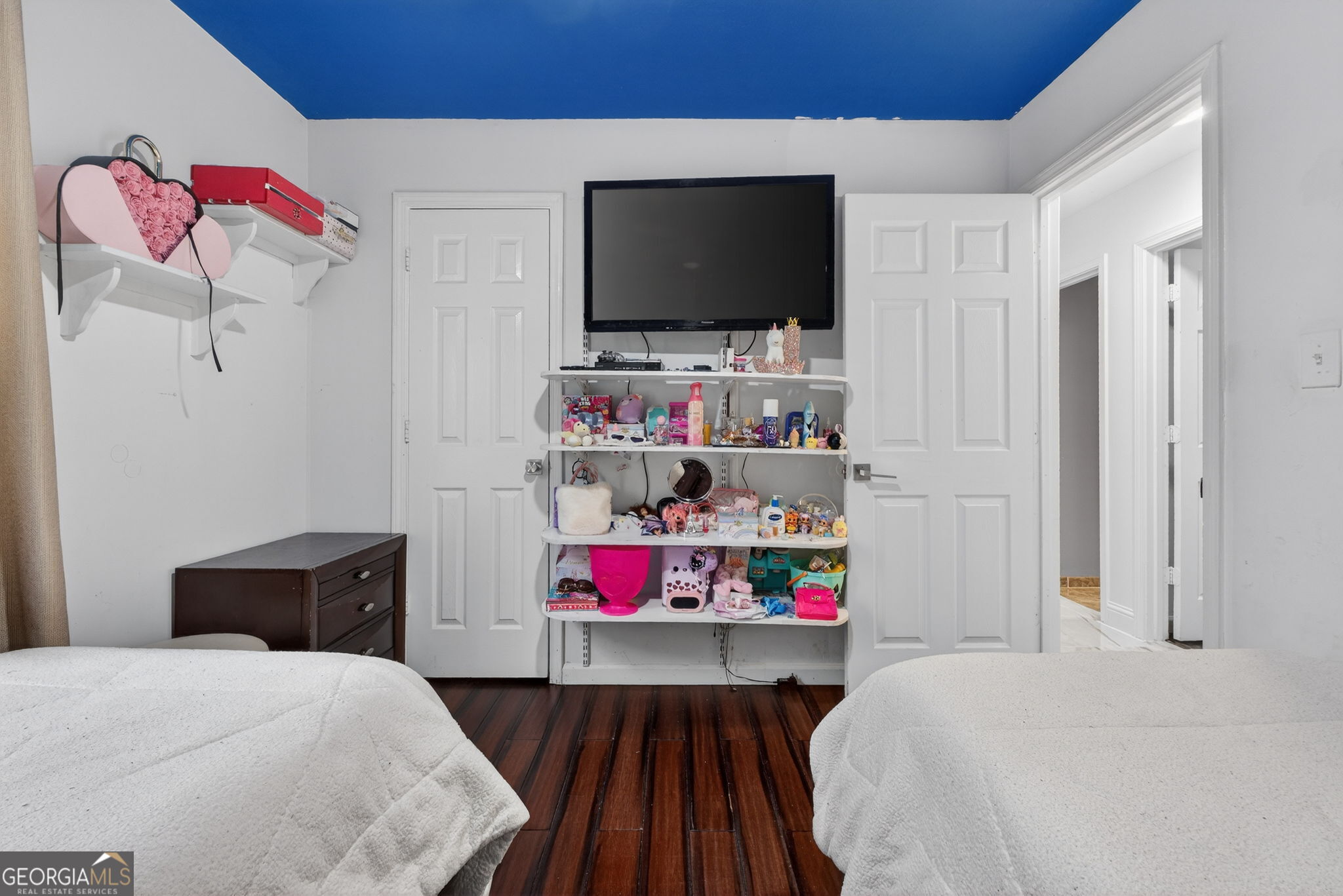 1589 Bonanza Church Road Hampton, GA 30228 - Photo 18 of 28 a bedroom with a bed and flat screen tv