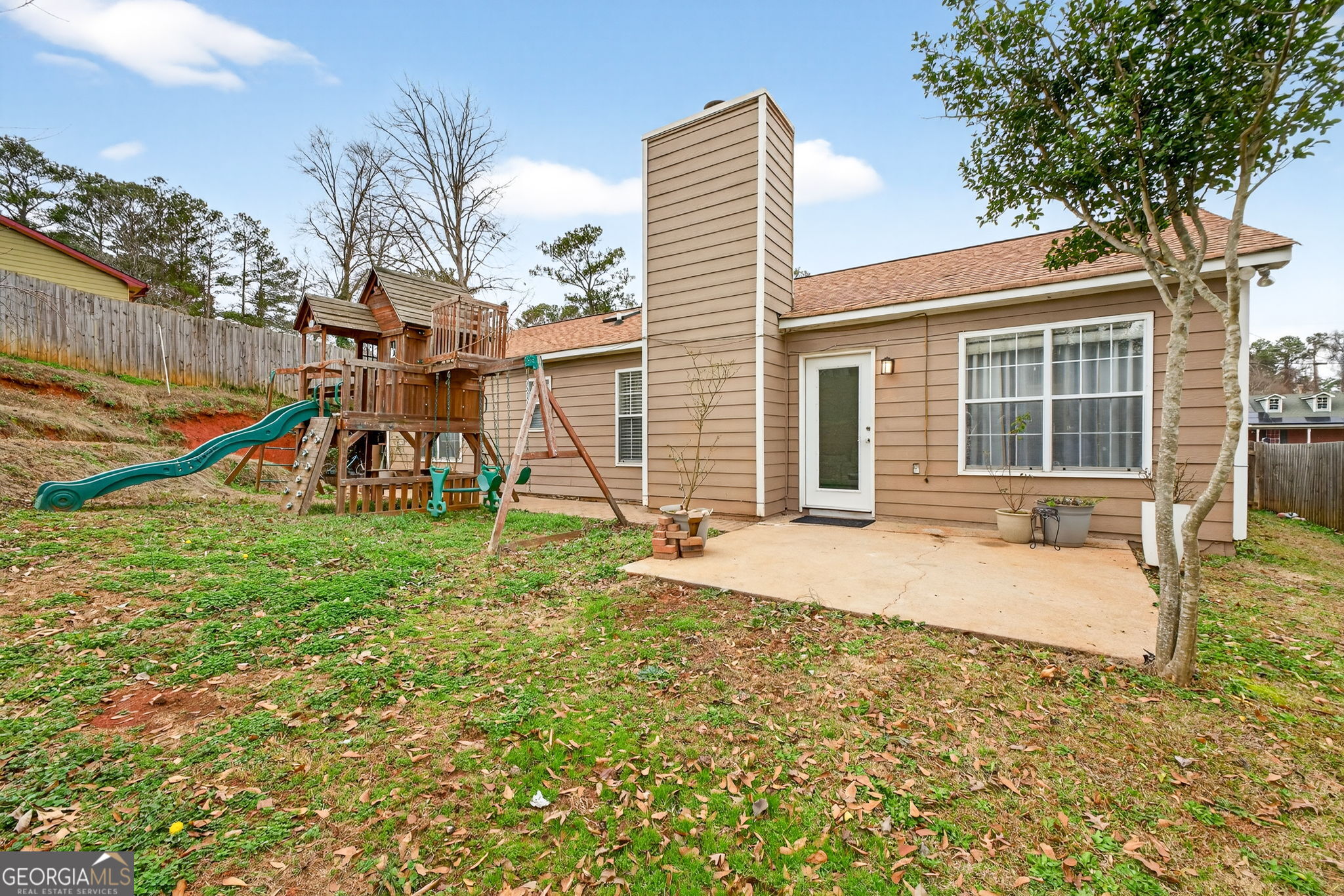1589 Bonanza Church Road Hampton, GA 30228 - Photo 23 of 28 a view of a house with backyard and a slide