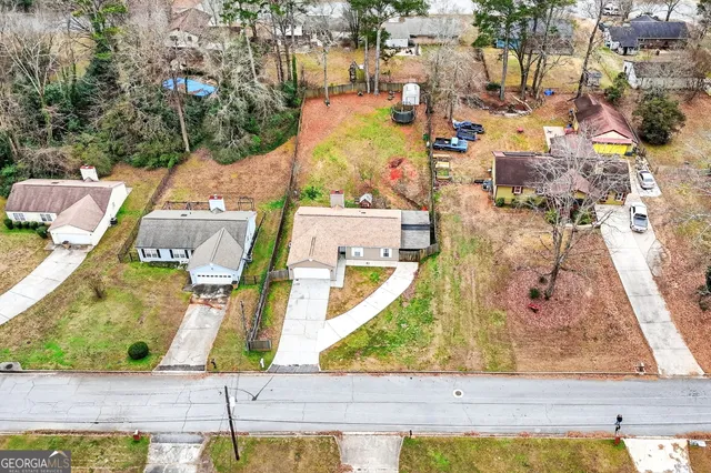 an aerial view of residential houses with outdoor space