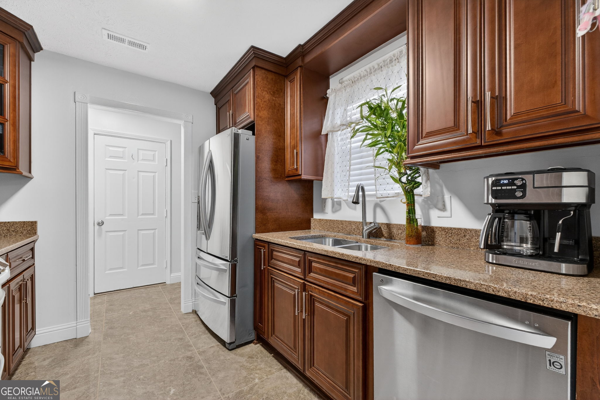 1589 Bonanza Church Road Hampton, GA 30228 - Photo 10 of 28 a kitchen with stainless steel appliances granite countertop a refrigerator and a sink