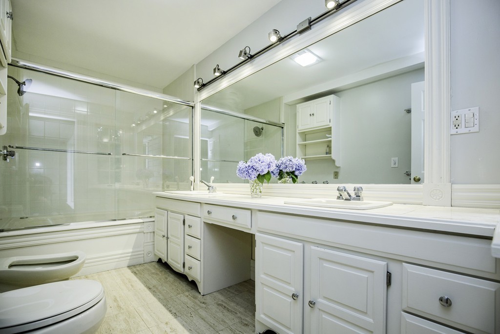 57 Oak Ridge Road Boxford, MA 01921 - Photo 15 of 30 a bathroom with a granite countertop sink a toilet and shower