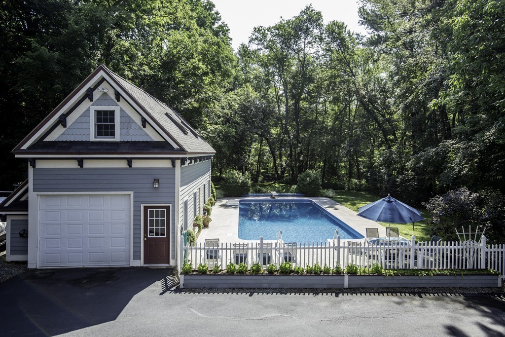 57 Oak Ridge Road Boxford, MA 01921 - Photo 24 of 30 a front view of a house with a yard