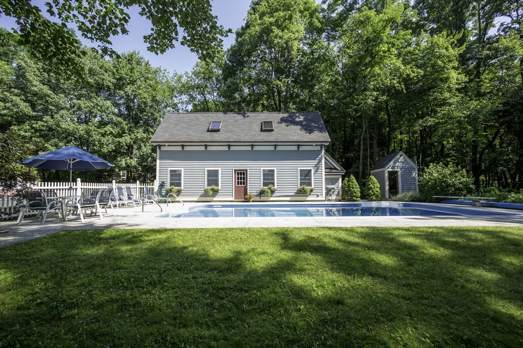 57 Oak Ridge Road Boxford, MA 01921 - Photo 30 of 30 a front view of a house with swimming pool having outdoor seating