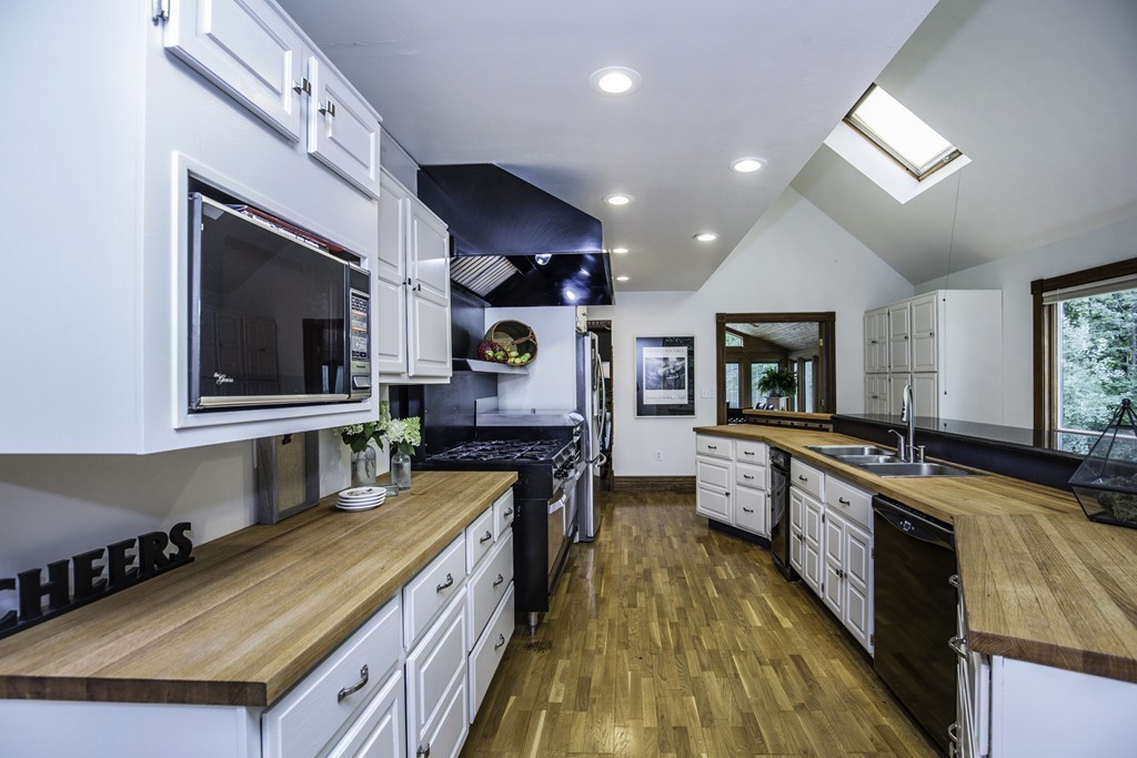 57 Oak Ridge Road Boxford, MA 01921 - Photo 9 of 30 a kitchen with stainless steel appliances granite countertop a stove and a sink
