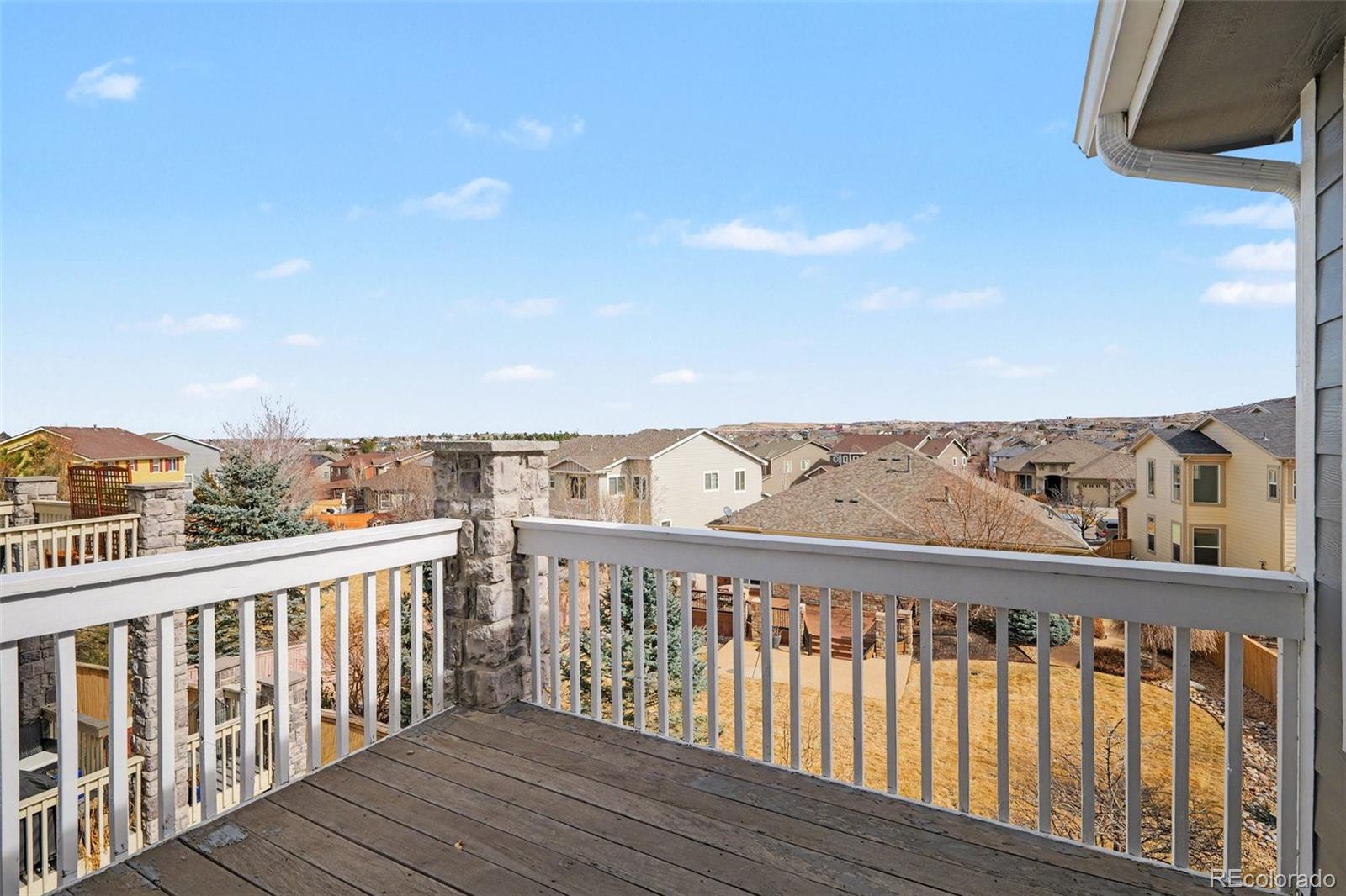 10844 Huntwick Street Highlands Ranch, CO 80130 - Photo 14 of 29 a view of a balcony with wooden floor