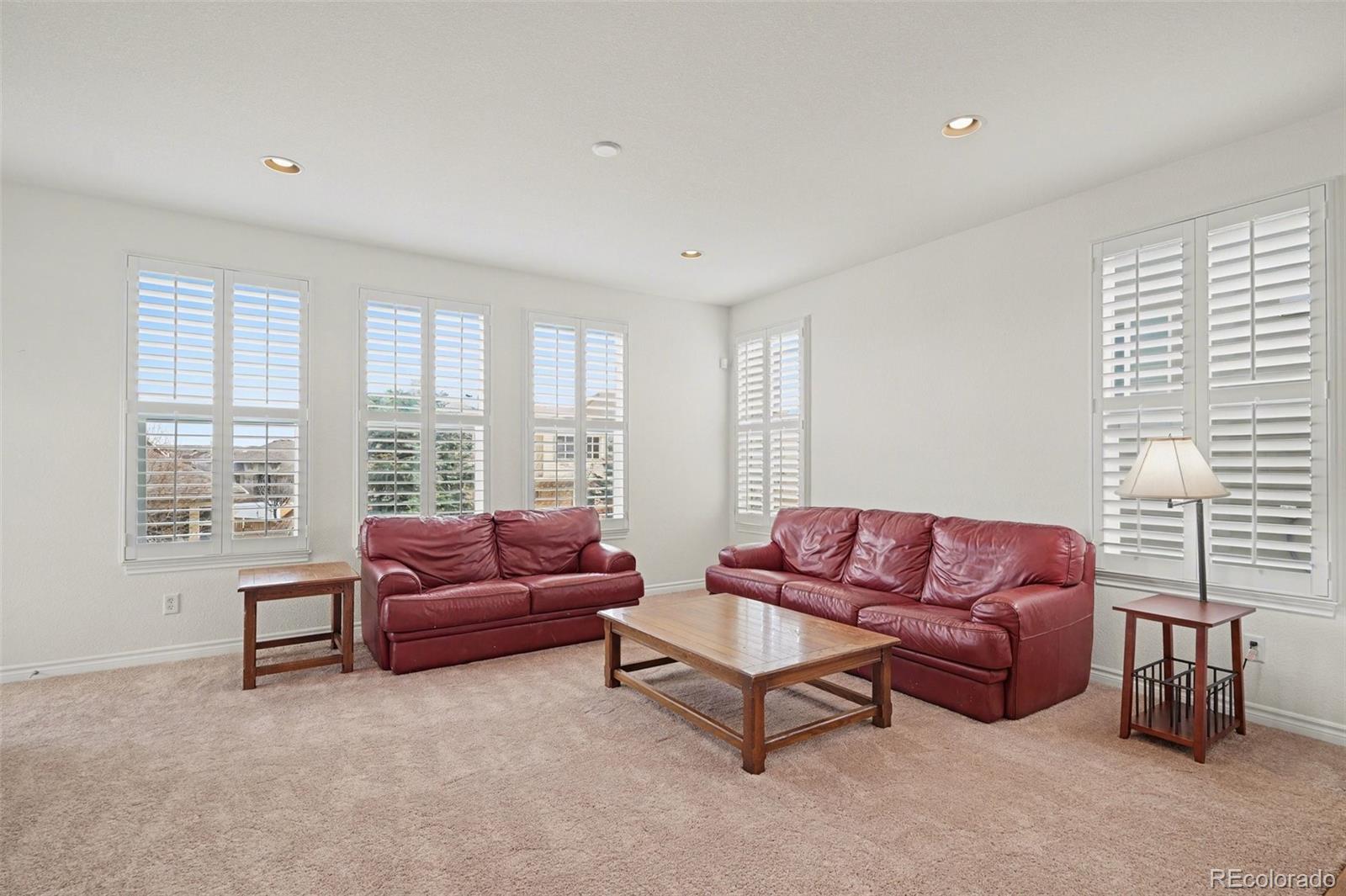 10844 Huntwick Street Highlands Ranch, CO 80130 - Photo 8 of 29 a living room with furniture and a large window