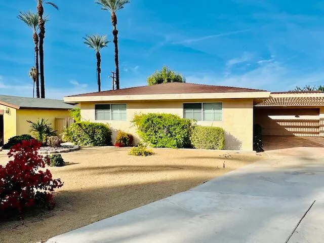 a view of a house with a street