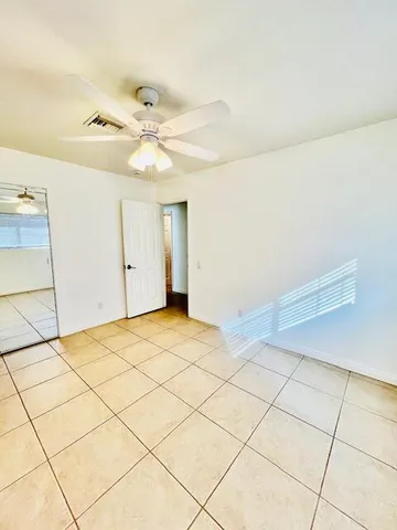 a view of a room with an empty space and a sink