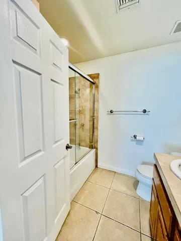 a bathroom with a bathtub and shower