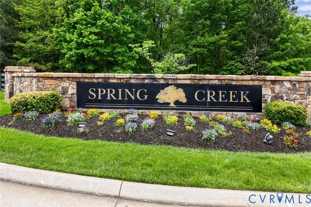 a front view of a house with a yard table and chairs