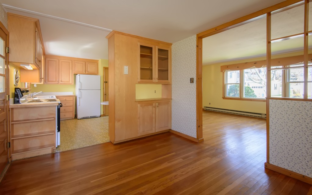 11 Dartmouth Road Marblehead, MA 01945 - Photo 11 of 25 a view of a kitchen with a fridge wooden floor and a window
