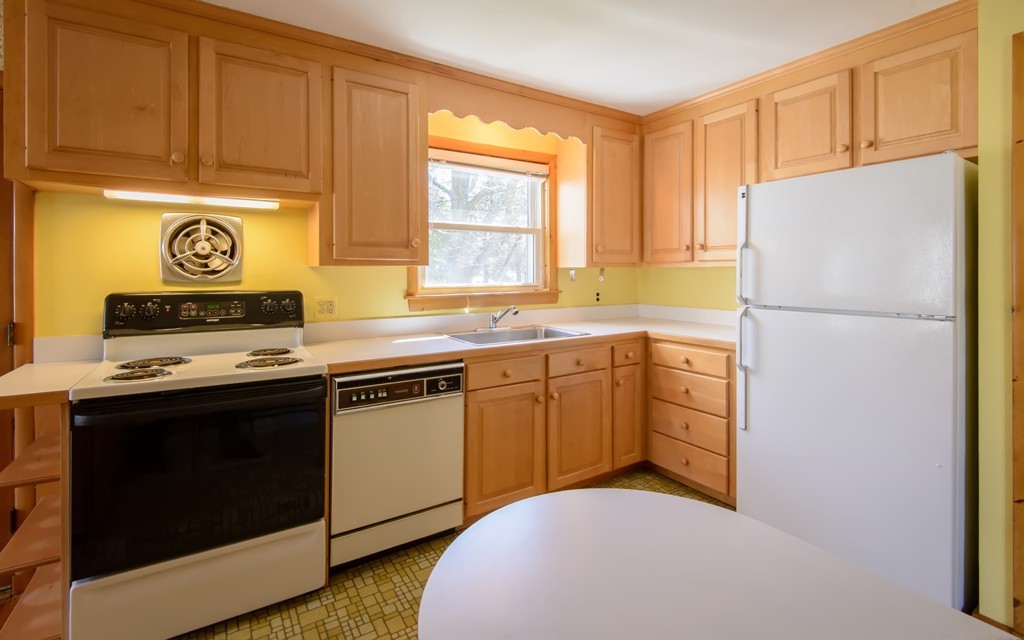 11 Dartmouth Road Marblehead, MA 01945 - Photo 14 of 25 a kitchen with a refrigerator stove and sink