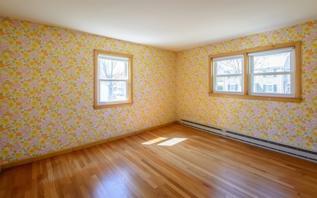 11 Dartmouth Road Marblehead, MA 01945 - Photo 19 of 25 a view of an empty room with wooden floor and a window