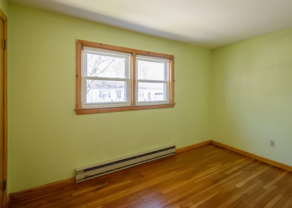 11 Dartmouth Road Marblehead, MA 01945 - Photo 21 of 25 a view of a room with wooden floor and a window