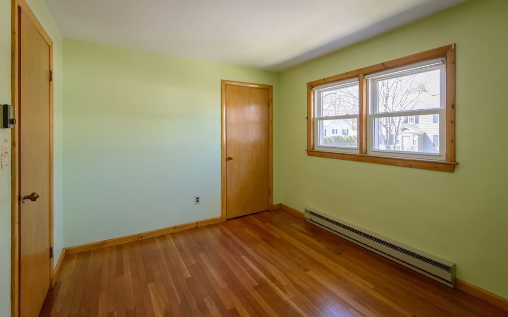 11 Dartmouth Road Marblehead, MA 01945 - Photo 22 of 25 a view of an empty room with wooden floor and a window
