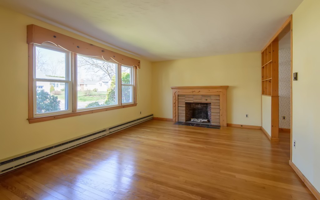 11 Dartmouth Road Marblehead, MA 01945 - Photo 5 of 25 a view of an empty room with a window and wooden floor