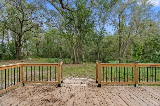 a view of a deck with a backyard