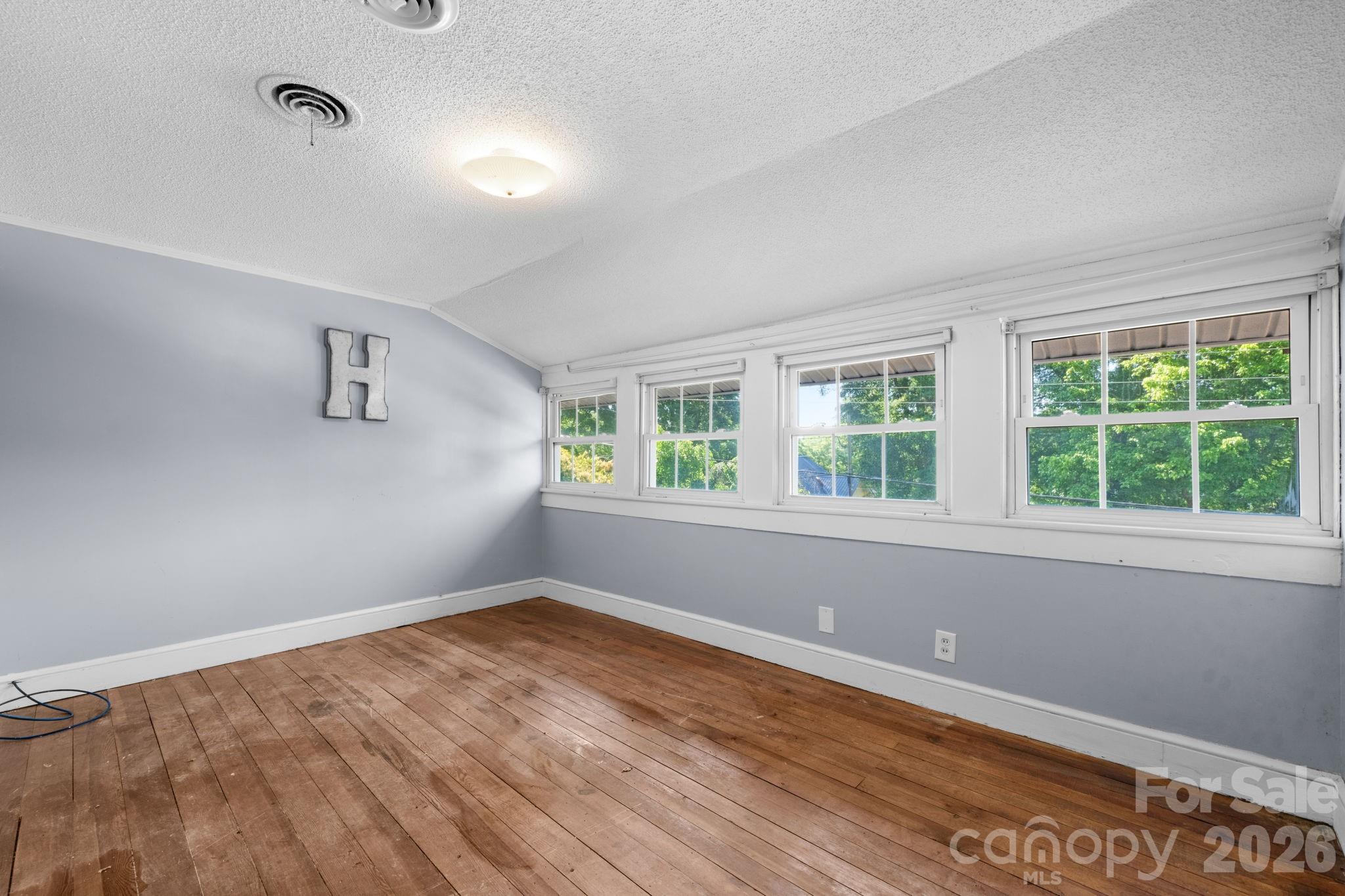 144 Hunter Bridge Road Stony Point, NC 28678 - Photo 27 of 45 wooden floor in an empty room with a window