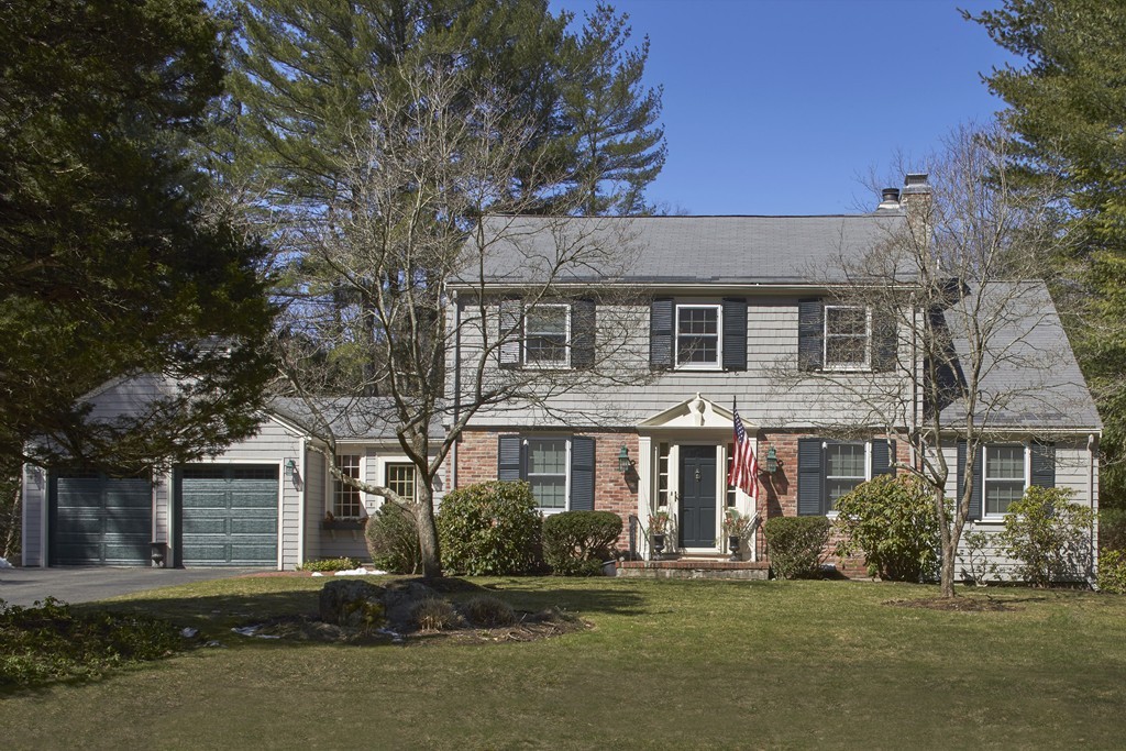 65 Montvale Road Weston, MA 02493 - Photo 1 of 11 front view of a house with a yard