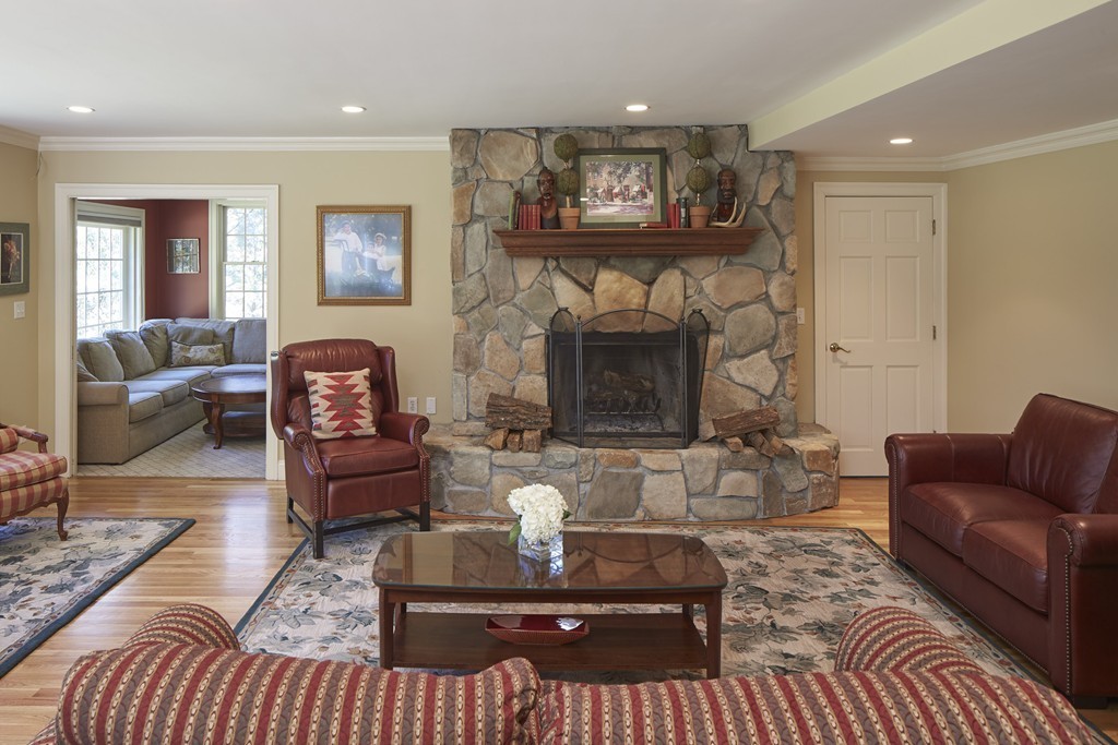 65 Montvale Road Weston, MA 02493 - Photo 3 of 11 a living room with furniture and a fireplace