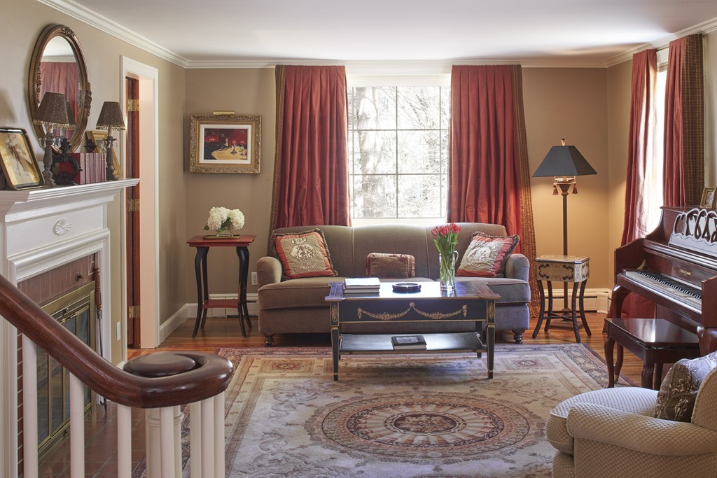 65 Montvale Road Weston, MA 02493 - Photo 5 of 11 a living room with furniture a fireplace and a large window