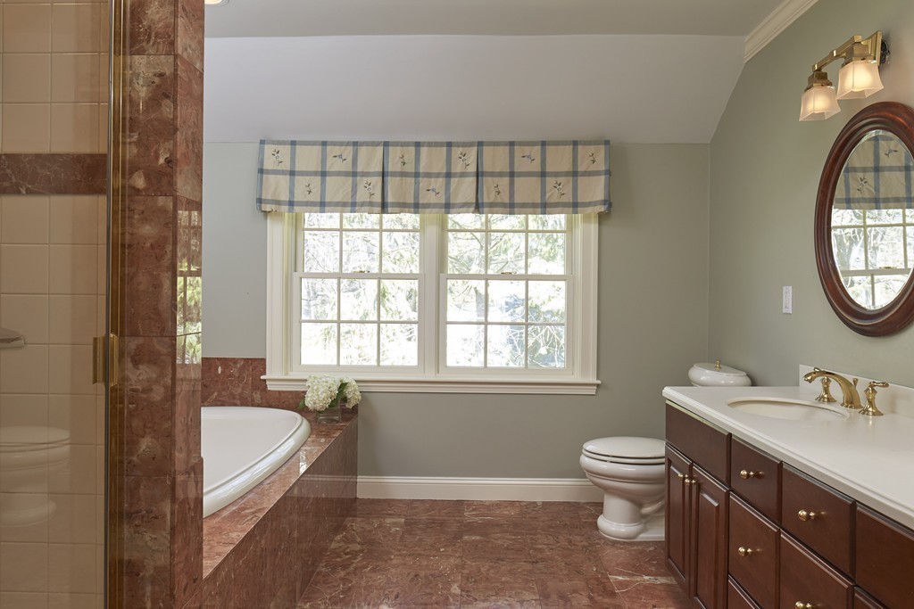 65 Montvale Road Weston, MA 02493 - Photo 8 of 11 a bathroom with a sink a toilet and a bathtub