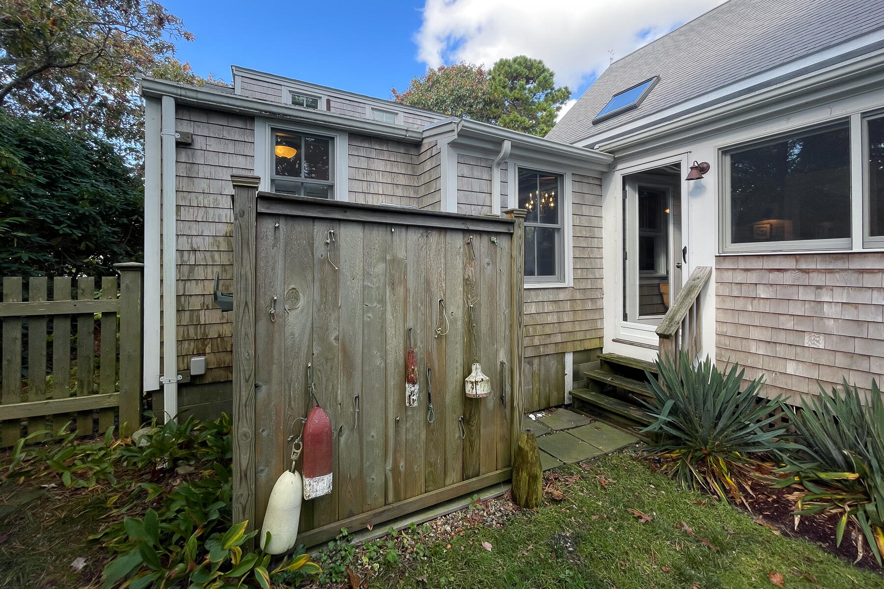 23 Forest Beach Rd Extension South Chatham, MA 02659 - Photo 11 of 43 a backyard of a house with plants and outdoor seating