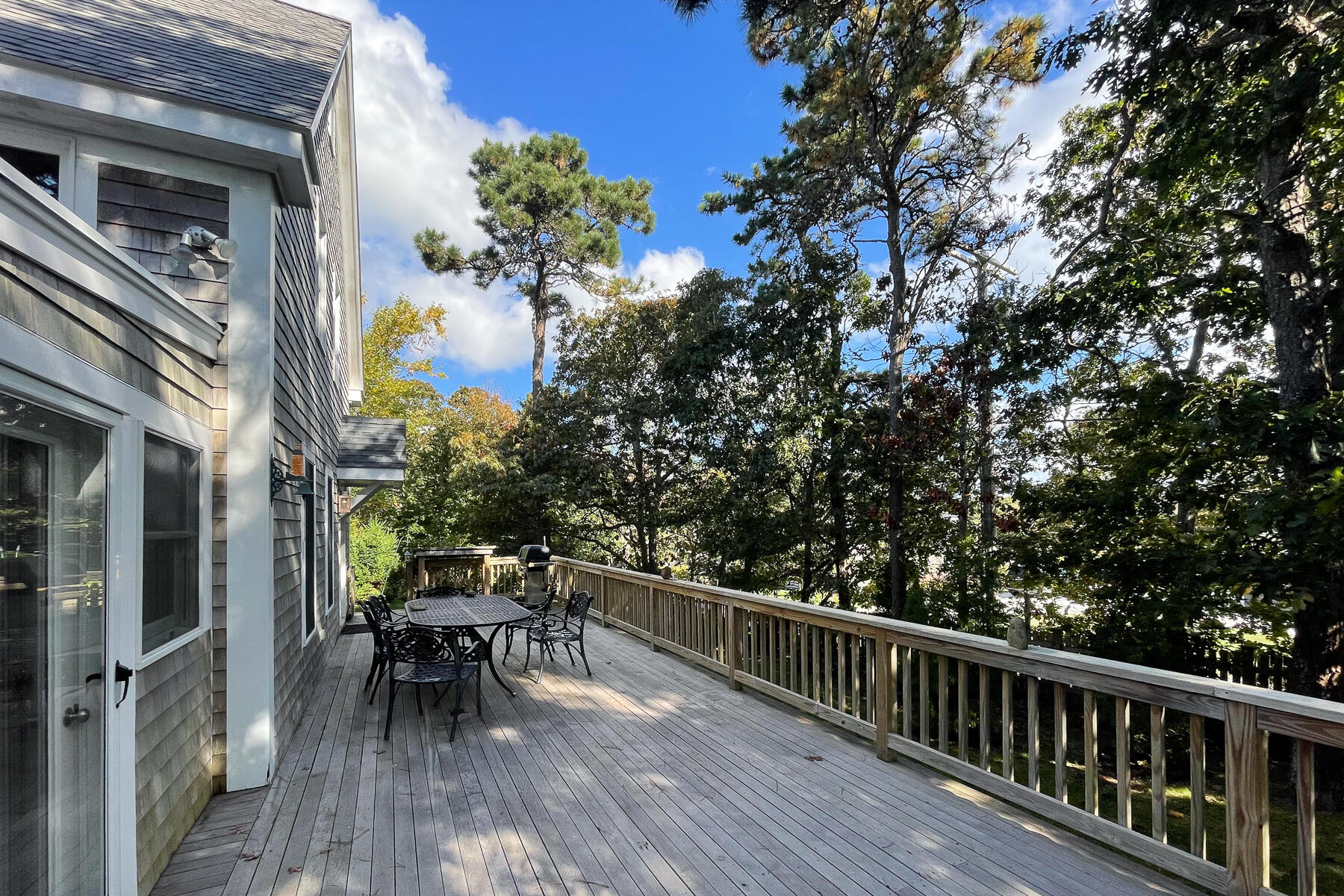 23 Forest Beach Rd Extension South Chatham, MA 02659 - Photo 13 of 43 a balcony with wooden floor and outdoor seating
