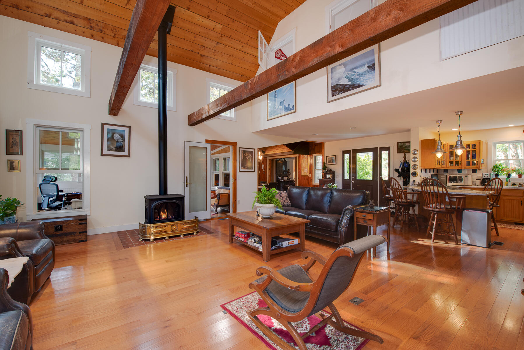 23 Forest Beach Rd Extension South Chatham, MA 02659 - Photo 17 of 43 a living room with furniture a flat screen tv and kitchen view