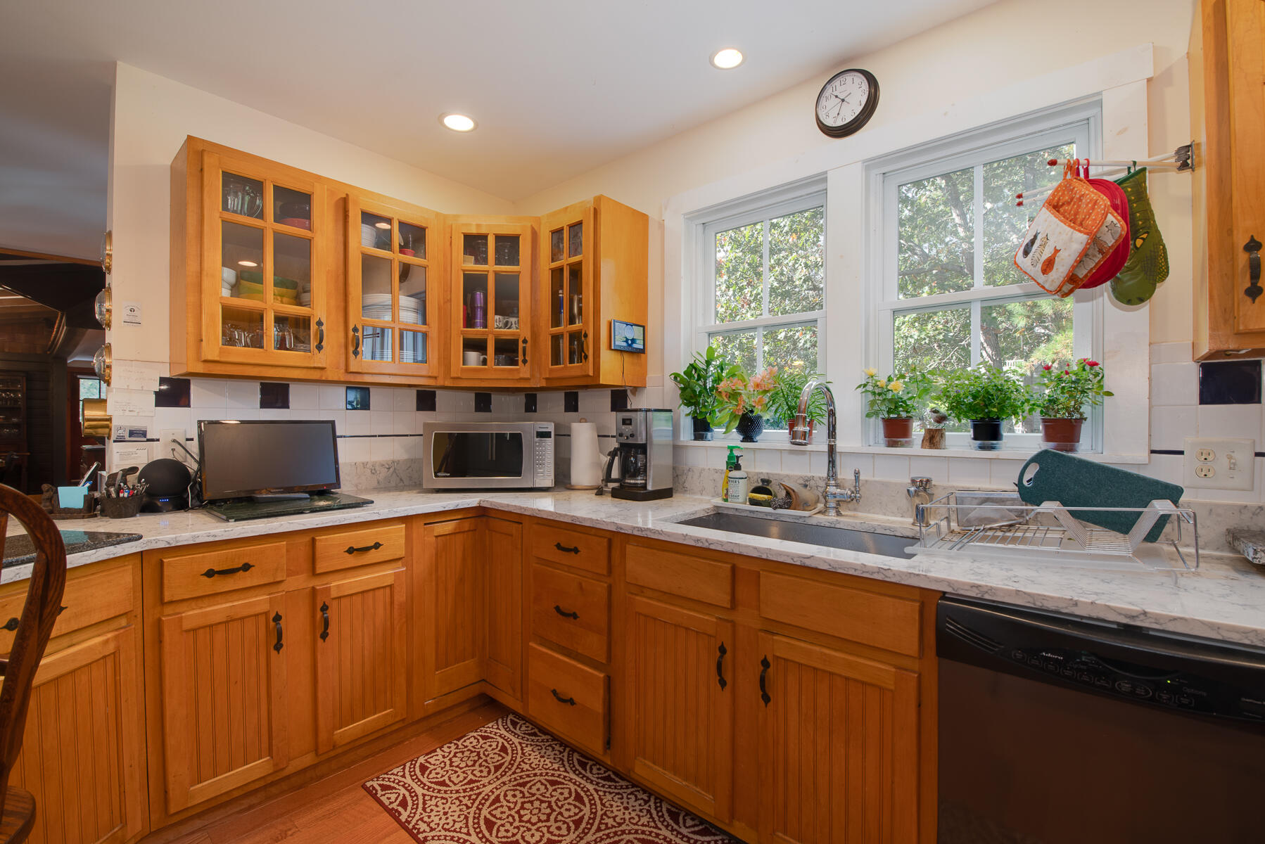 23 Forest Beach Rd Extension South Chatham, MA 02659 - Photo 24 of 43 a kitchen with stainless steel appliances granite countertop a sink and cabinets