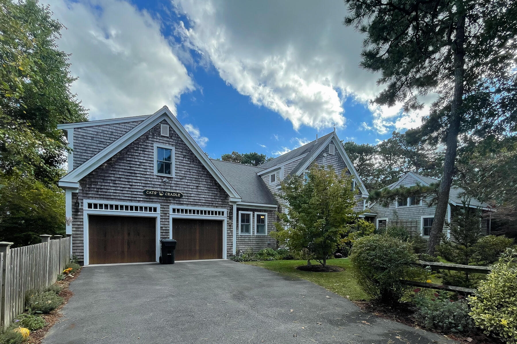 23 Forest Beach Rd Extension South Chatham, MA 02659 - Photo 6 of 43 a front view of a house with a garden