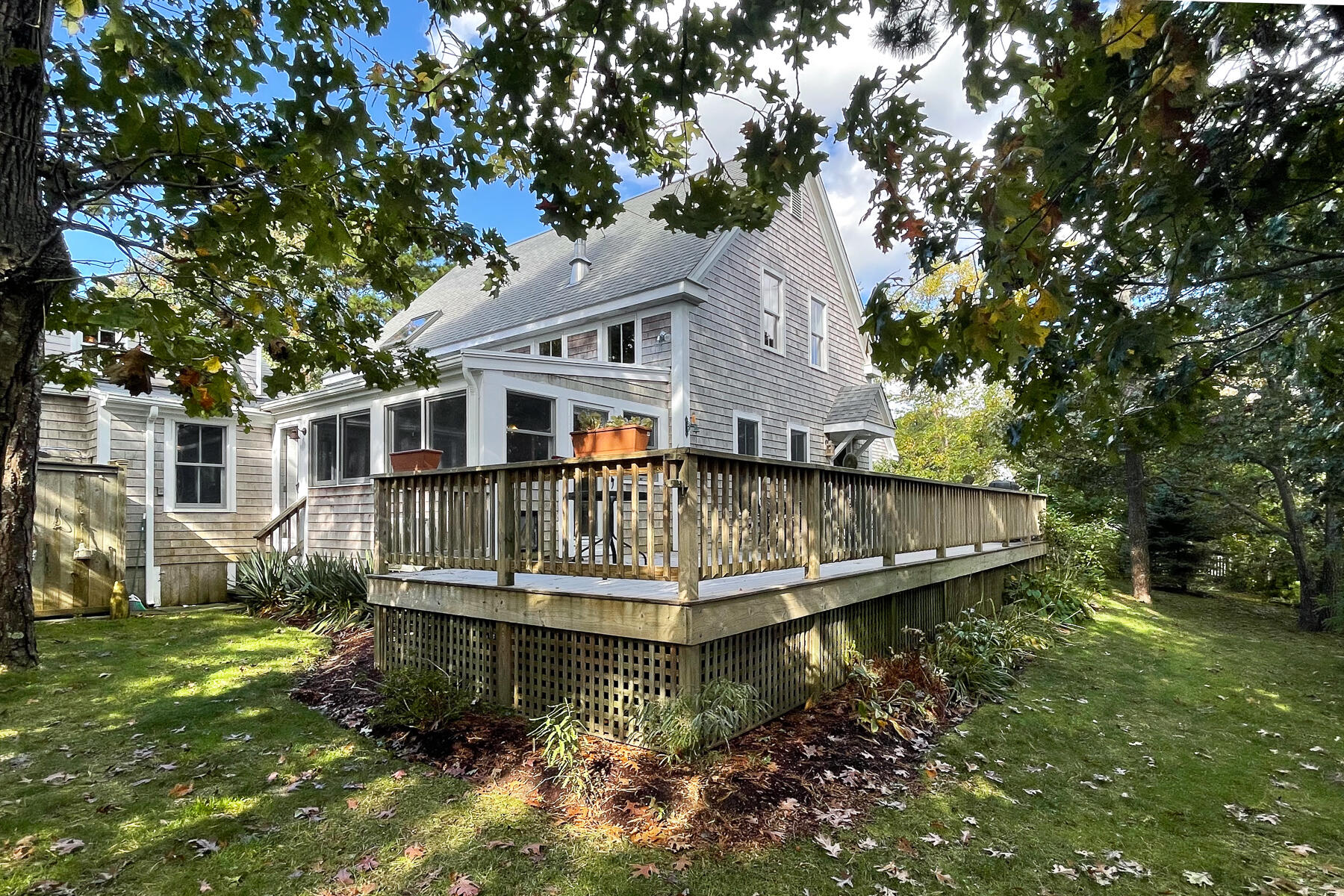 23 Forest Beach Rd Extension South Chatham, MA 02659 - Photo 7 of 43 a house with trees in the background