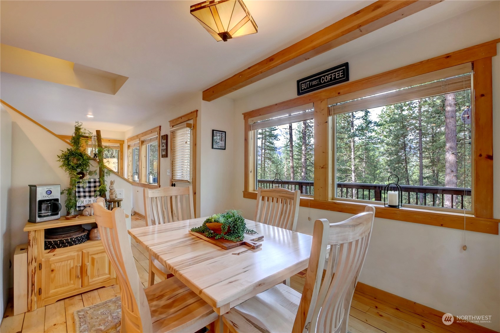 17 Mustard Mountain Road Winthrop, WA 98862 - Photo 9 of 36 a dining room with furniture large windows and wooden floor