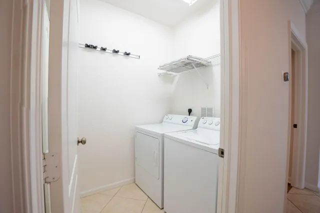 a bathroom with a granite countertop sink a mirror and a bathtub