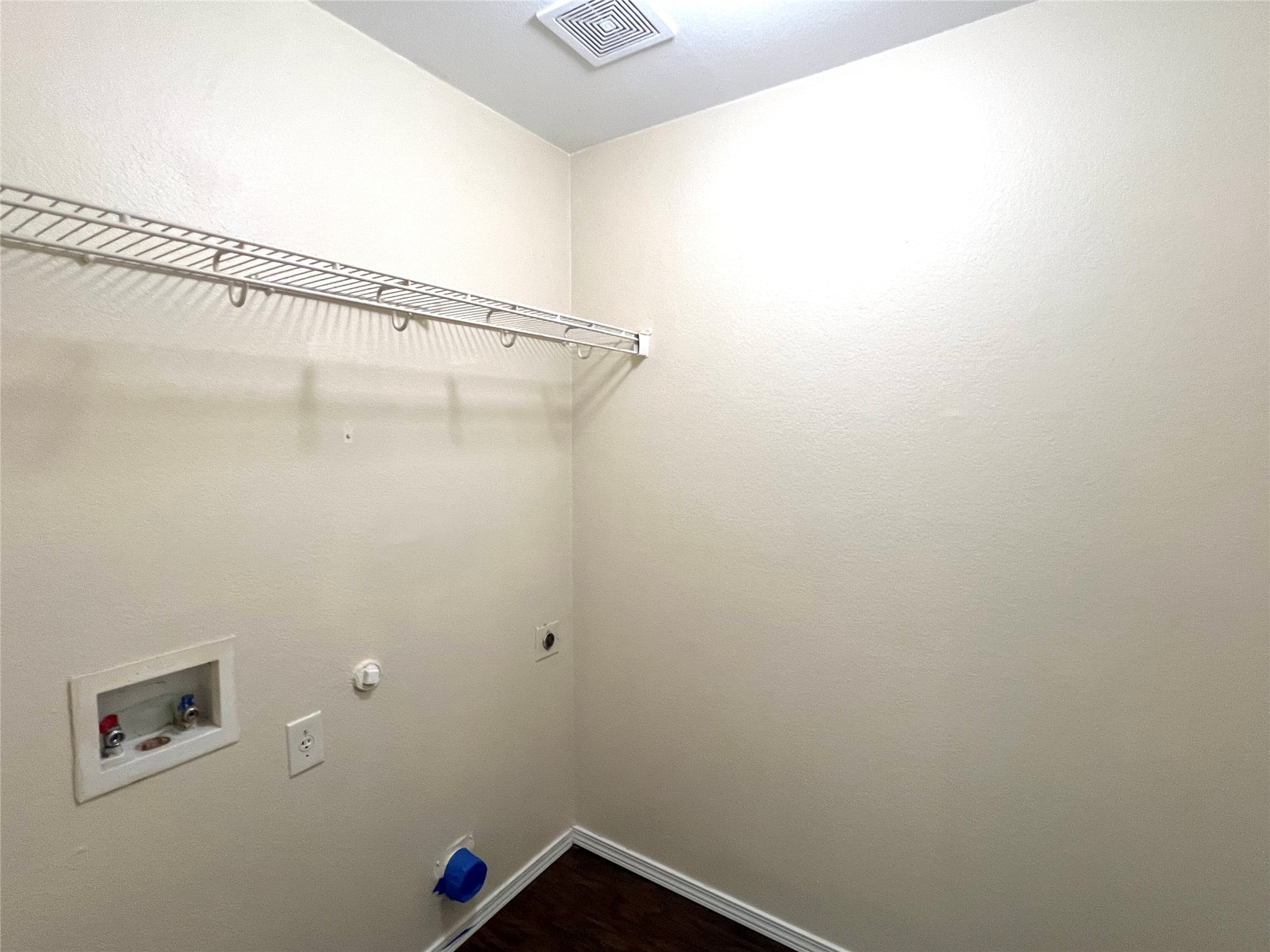 125 Dandelion Loop Kyle, TX 78640 - Photo 12 of 25 a view of a room with rack on the wall