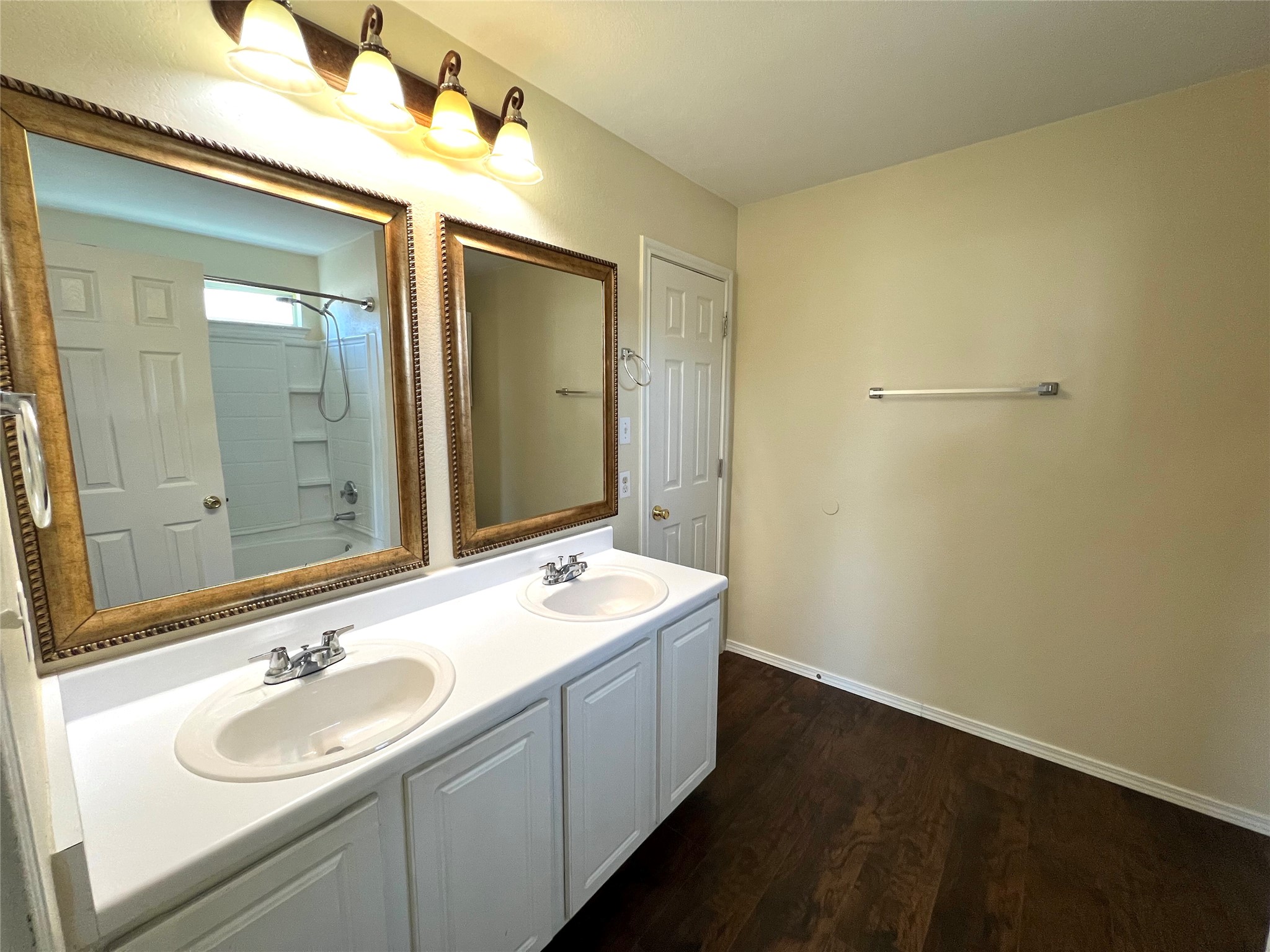 125 Dandelion Loop Kyle, TX 78640 - Photo 21 of 25 a bathroom with a sink and a mirror