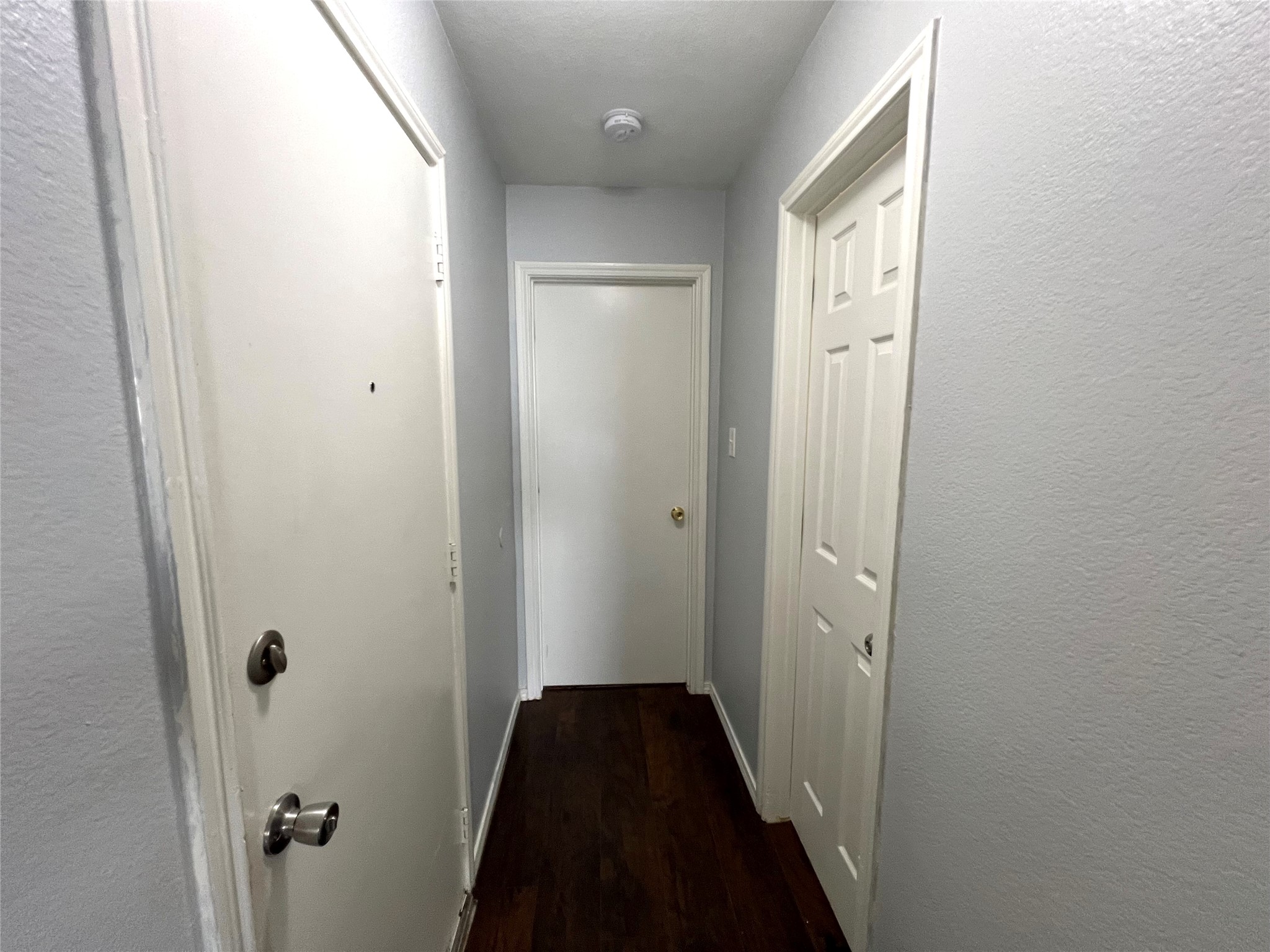125 Dandelion Loop Kyle, TX 78640 - Photo 7 of 25 a view of a bathroom from a hallway