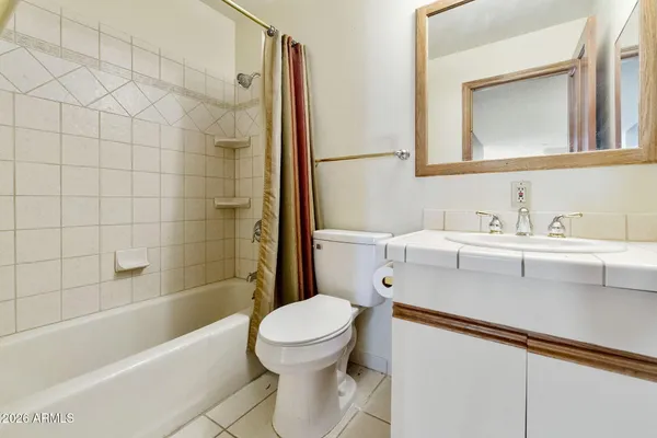a bathroom with a sink a toilet and a bathtub