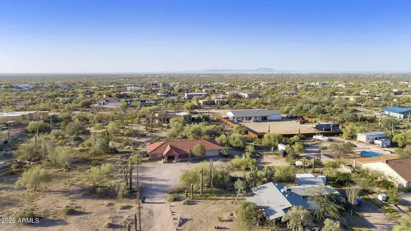 a view of a large building with mountains in the background