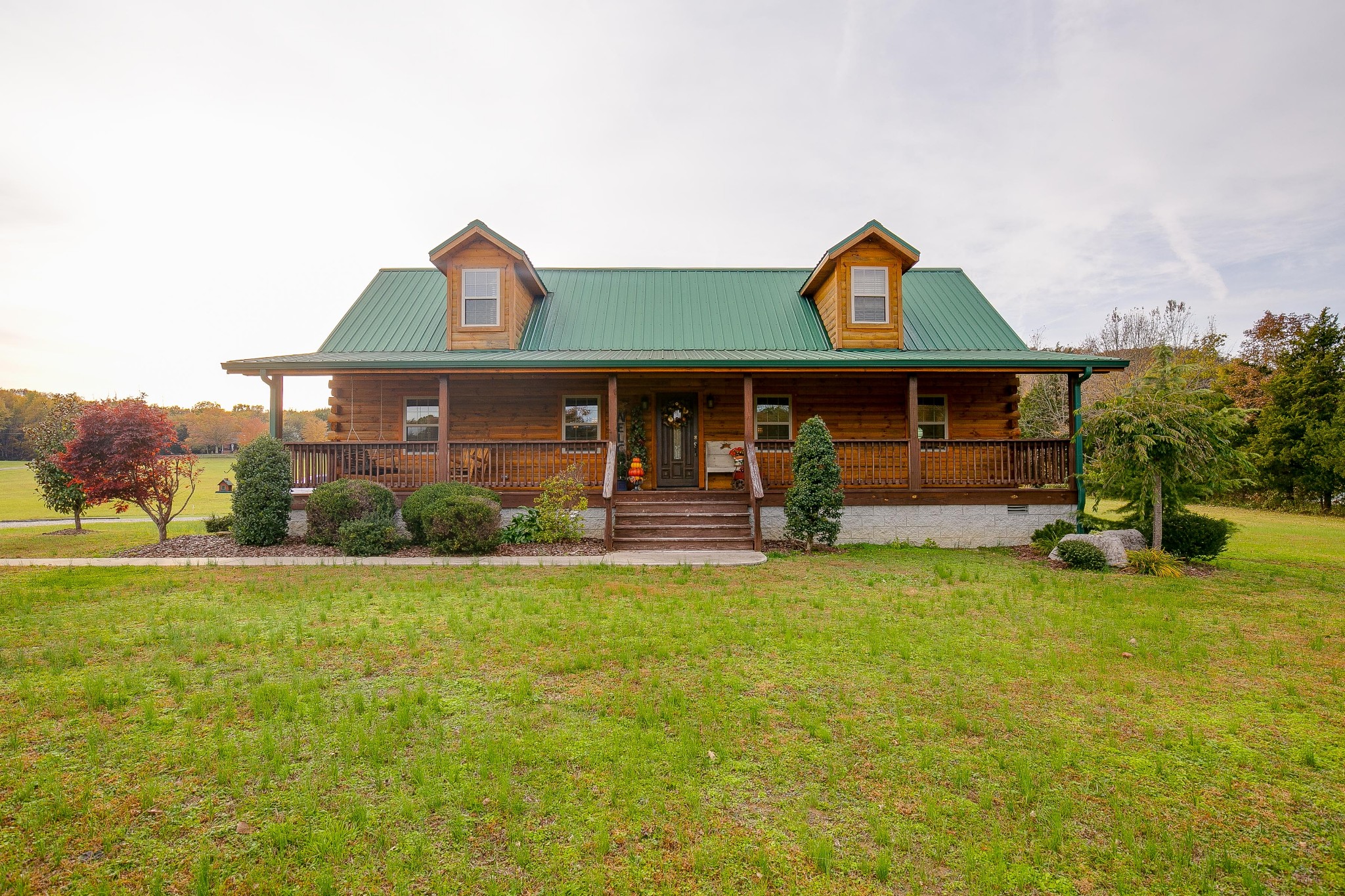 a front view of a house with garden