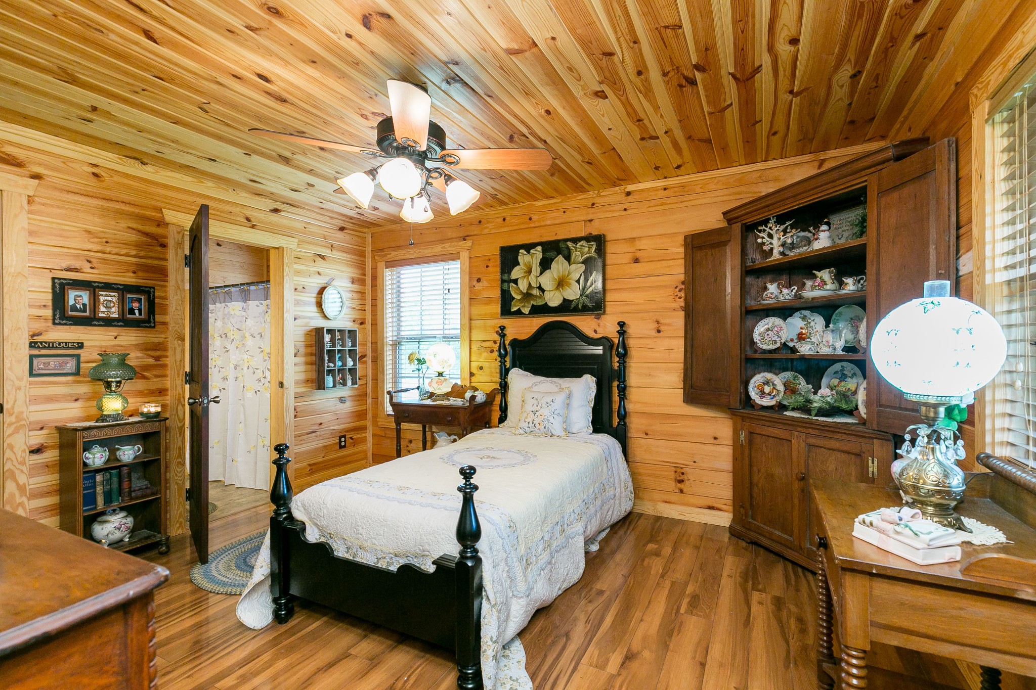 1362 Shop Springs Road Lebanon, TN 37090 - Photo 22 of 41 a bedroom with a bed and wooden floor