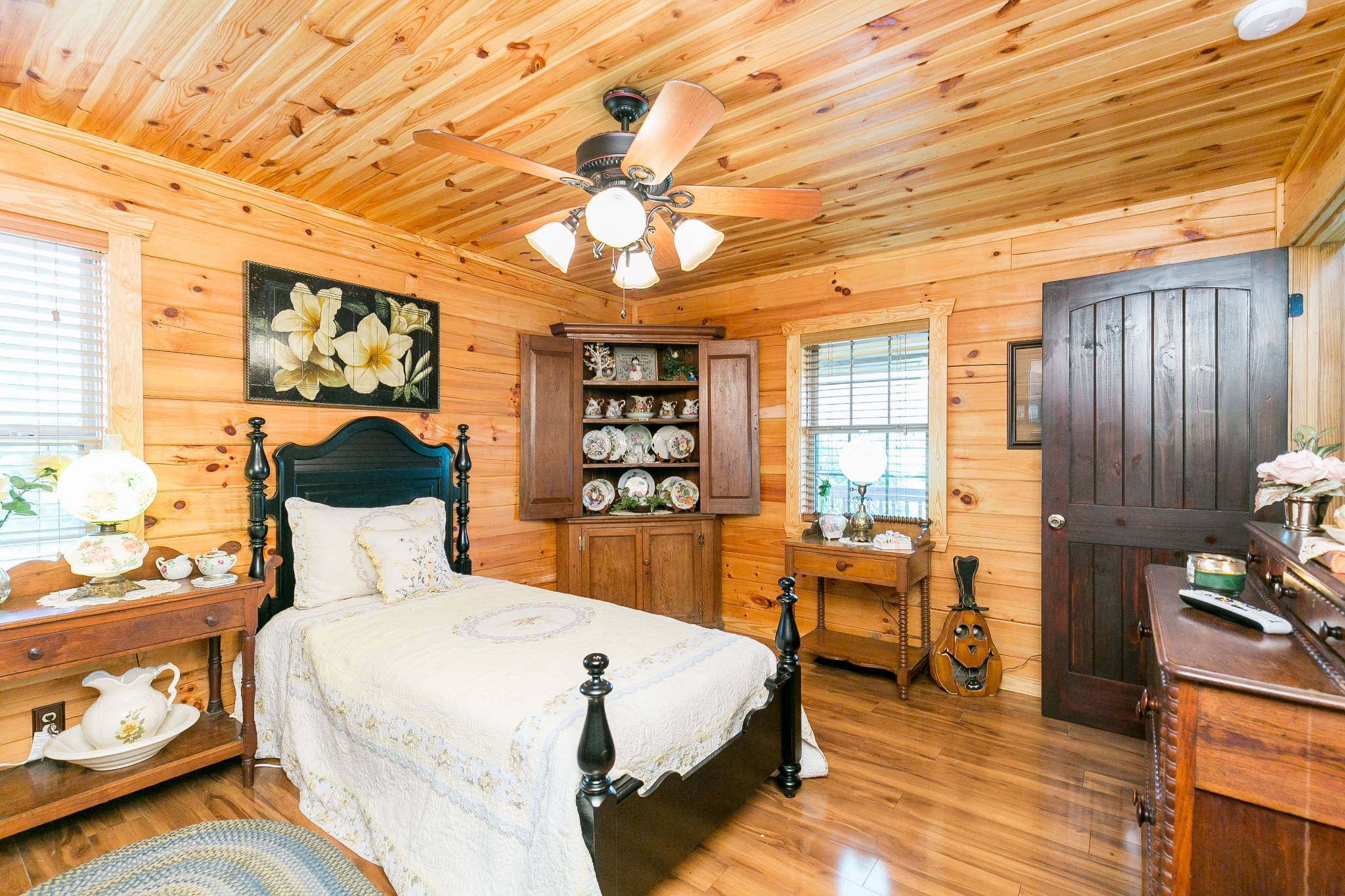 1362 Shop Springs Road Lebanon, TN 37090 - Photo 23 of 41 a bedroom with a large bed and a chandelier