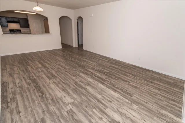 a view of a livingroom with wooden floor