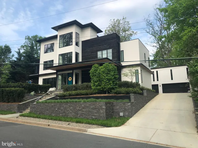 a front view of a house with garage