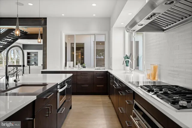 a utility room with sink dryer and washer