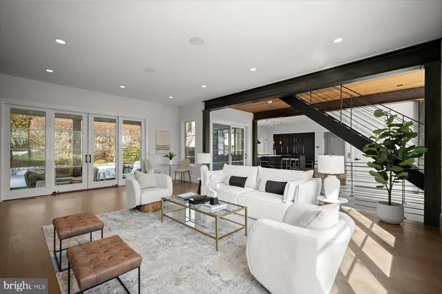 a roof deck view with table and chairs with wooden floor and fence