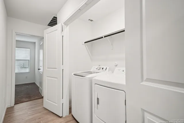 a utility room with dryer and washer