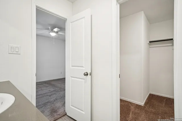a view of a bathroom with a shower and a sink