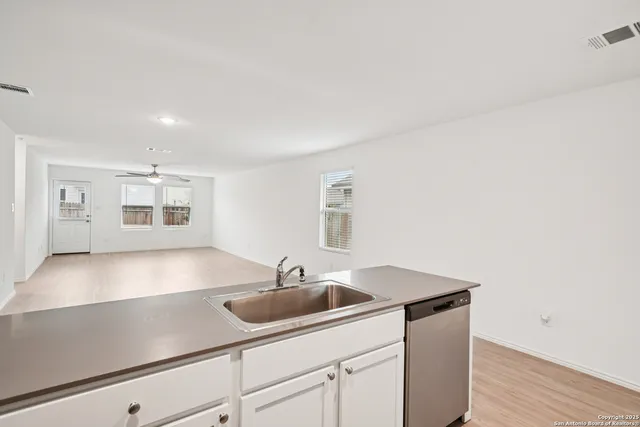 a kitchen with a sink and a window