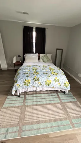 a large white bed in a small room
